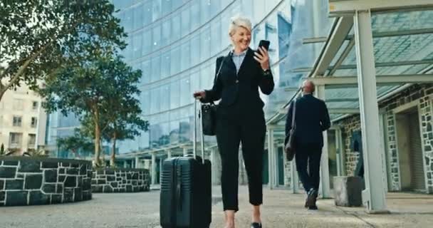 Business woman, suitcase and phone in city with funny communication, transport meme and travel news or flight. Corporate boss with happy mobile chat, luggage and walking outdoor to airport or hotel. - Footage, Video