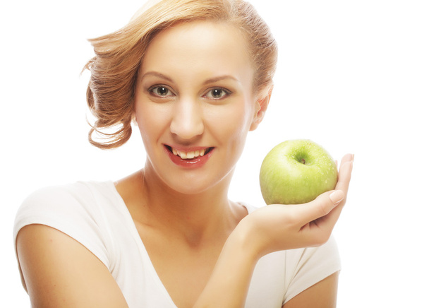 Woman holding green apple. - Foto, Imagen