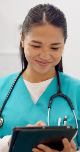 Medical, nurse or woman with tablet for research, networking or telehealth in hospital or clinic with smile. Healthcare, professional or expert with touchscreen for online, planning or communication. - Footage, Video
