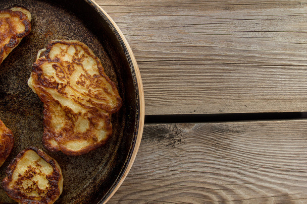 Pan with pancakes left rustic table - Фото, изображение