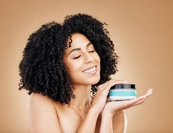Happy woman, container and hair, product for curls and shine, beauty with smile and strong texture on studio background. Advertising, haircare cosmetics for growth and cosmetology with model and afro. - Φωτογραφία, εικόνα
