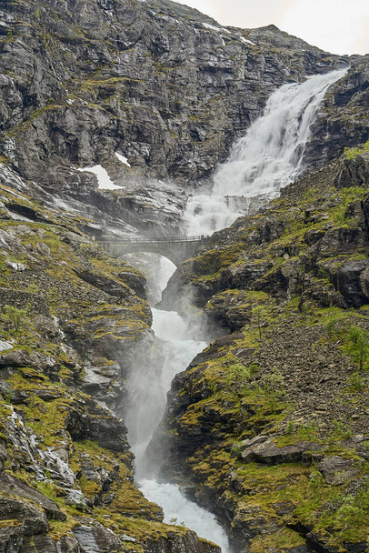waterfall in a mountain landscape at the Trollstigen scenic road in the mountains of Norway - Photo, Image