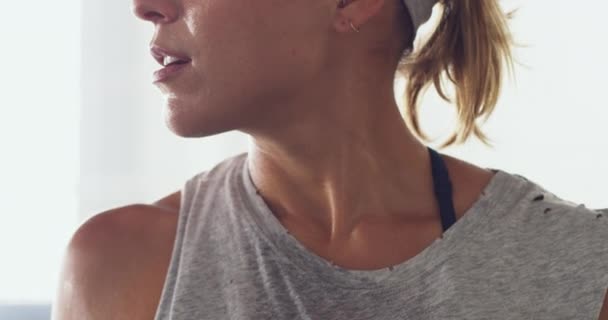 Face, woman and sweating from exercise in closeup, active and fitness with intense session in gym. Sports person, athlete and discipline with training commitment, routine and cardio to catch breath. - Footage, Video