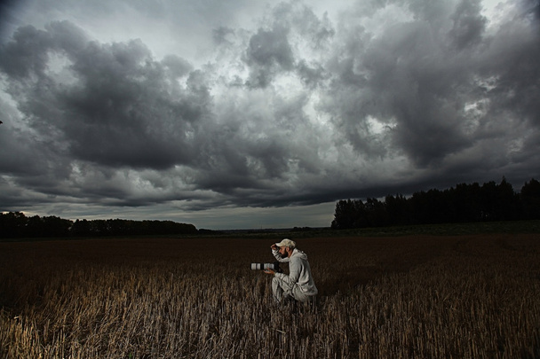 Photographer in autumn field - Photo, Image