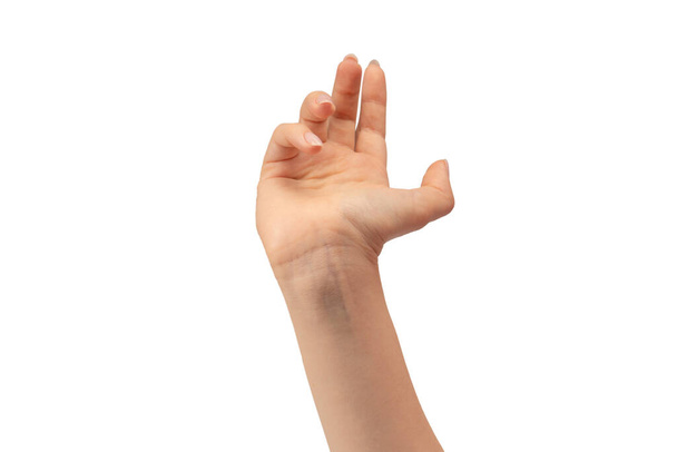 Mão de uma mulher segurar algum objeto minúsculo ou fino, isolado em um fundo branco. - Foto, Imagem
