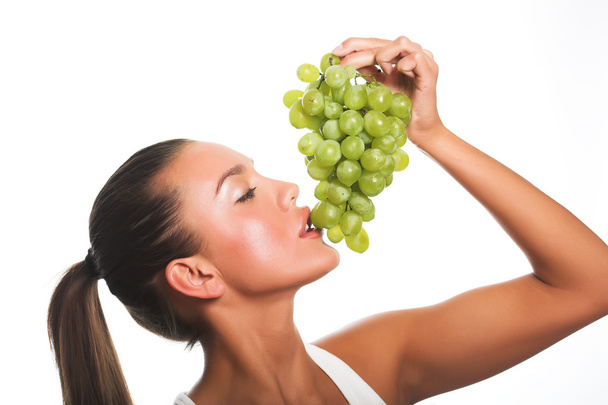 woman with green grape - Foto, imagen