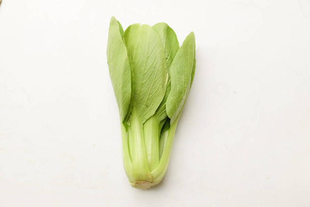 close up small Fresh raw organic green choy sum or bok choy isolate on a white background.vegetable in asian for cooking food . chinese vegetable - Photo, Image