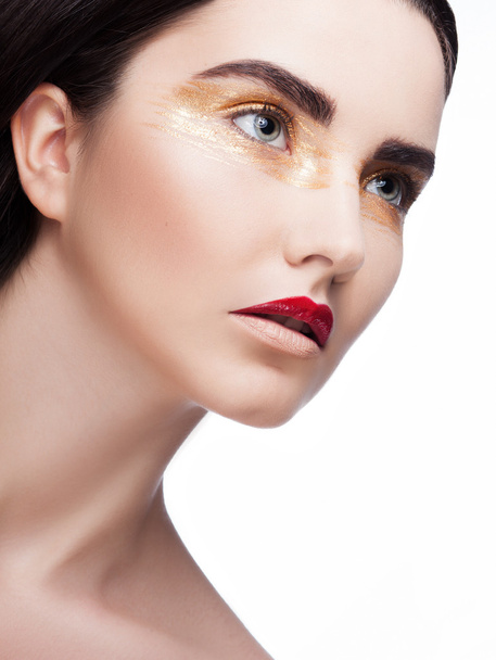 Женщина с золотым макияжем
 - Фото, изображение