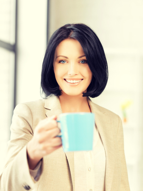 lovely businesswoman with mug - Фото, изображение