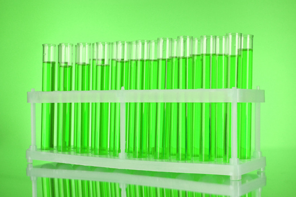 Test-tubes on green background - Photo, Image