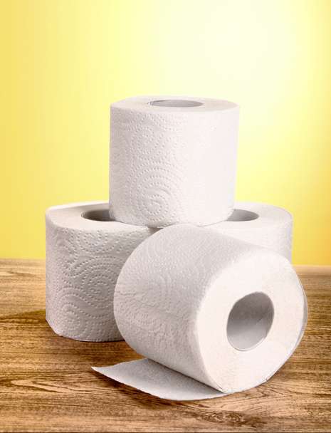 Toilet pape on yellow background - Foto, immagini