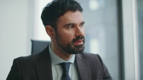 Frustrated boss feeling anger for work mistake sitting company office close up. Furious bearded businessman reacting emotionally at business crisis indoors. Stressed investor worried about profit loss - Footage, Video