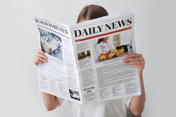 Woman reading morning newspaper on white background - Photo, Image