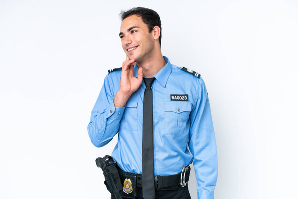 Молодий поліцейський кавказький чоловік ізольований на білому тлі думаючи про ідею під час пошуку
 - Фото, зображення