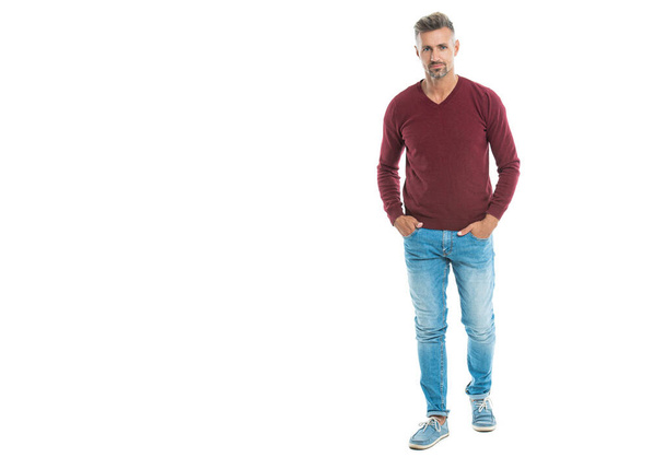 a caucasian man in his 40s at studio background with copy space banner. good looking caucasian man stands. full length of a handsome caucasian man isolated on white. A Caucasian man wearing pullover. - Foto, Imagem