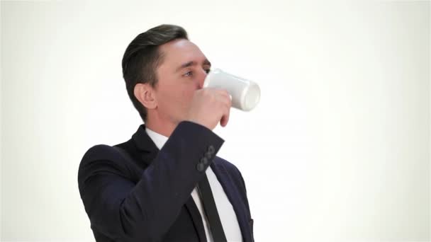 Formally dressed businessman drink from a cup, smiling and showing thumb. Business emotions. The businessmen in different situations and expression of their emotions. Human emotion facial expression - Footage, Video