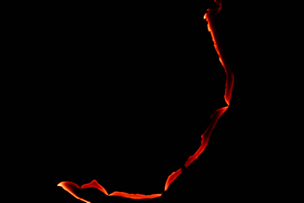 burning paper, glowing edge of paper on a black background - Foto, immagini