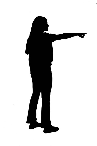  silhouet van jong meisje wijzend op witte achtergrond - Foto, afbeelding