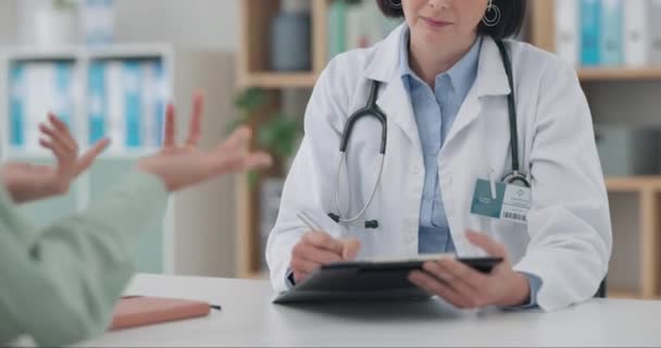 Hospital, clipboard and woman consulting doctor in consultation room for insurance, checklist or paperwork. Healthcare, compliance or female patient with nurse in a clinic for advice, surgery or plan. - Footage, Video