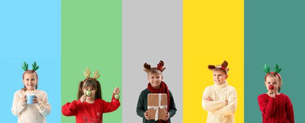 Sada dětí slaví Vánoce na barevném pozadí - Fotografie, Obrázek