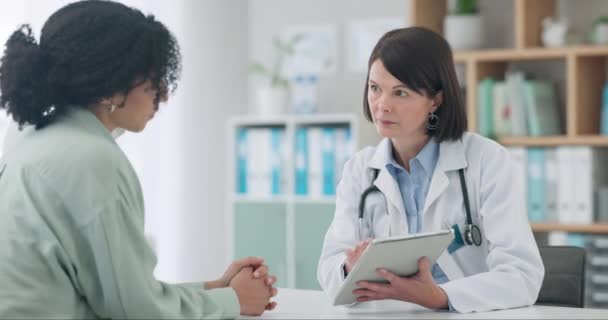 Meeting, woman and doctor with results on tablet in conversation with patient in office, clinic or healthcare. Medical, talk and people in consultation with tech for medicine, research and report. - Footage, Video