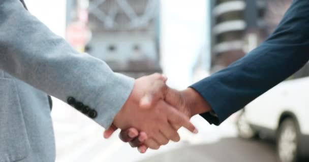 Business people, city and shaking hands for agreement of deal, b2b promotion or success of negotiation. Closeup, team handshake and introduction of partnership, support integration and reward outdoor. - Footage, Video