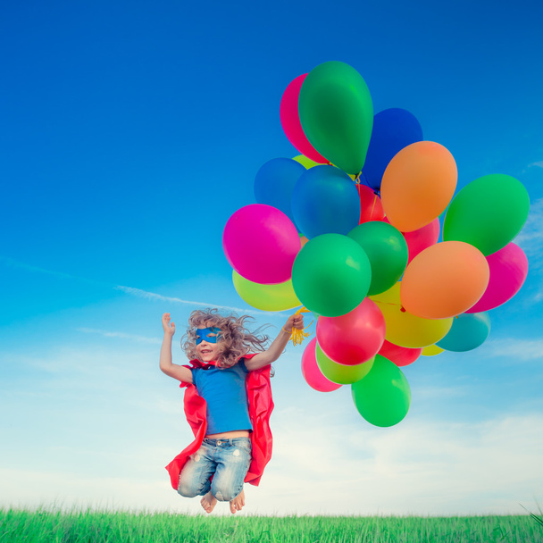 Superhero with toy balloons - 写真・画像