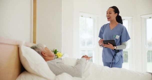 Doctor, elderly care and tablet for consultation in nursing home with results, internet or diagnosis. Happy woman, nurse and sick patient in bed for health, wellness or surgery for trust or medicine. - Footage, Video