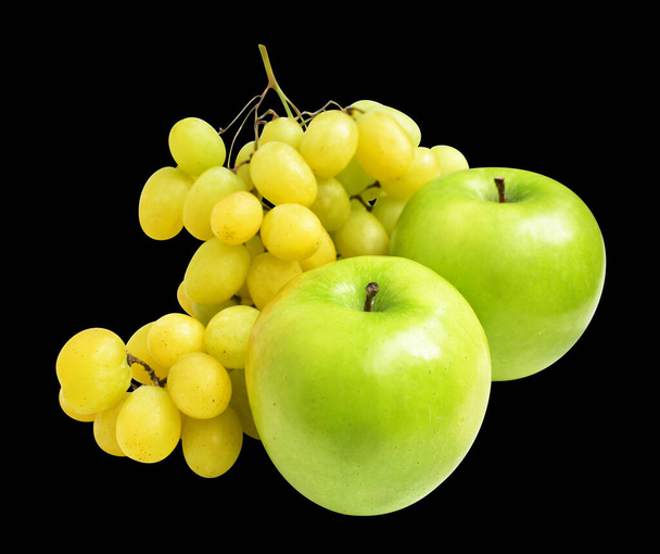 Green grape and green apple isolated, no shadow with clipping path in black background, healthy fresh fruit - Photo, Image