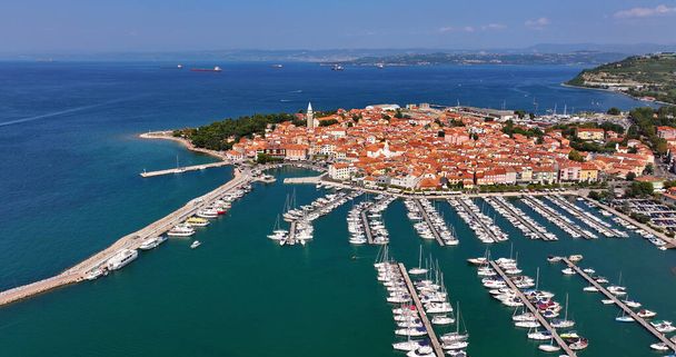 Aerial view of the old fishing town, Izola, on an impressive summer day in Slovenia, Europe. Beautiful seascape of the Adriatic Sea - Photo, Image