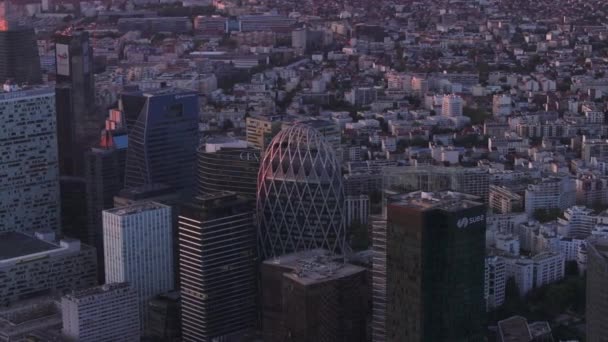 Group of high rise office buildings in La Defense district. Multistorey residential buildings in background. Metropolis at dusk. Paris, France. - Footage, Video