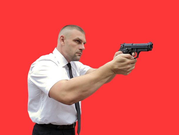 mies aseen kanssa - Valokuva, kuva