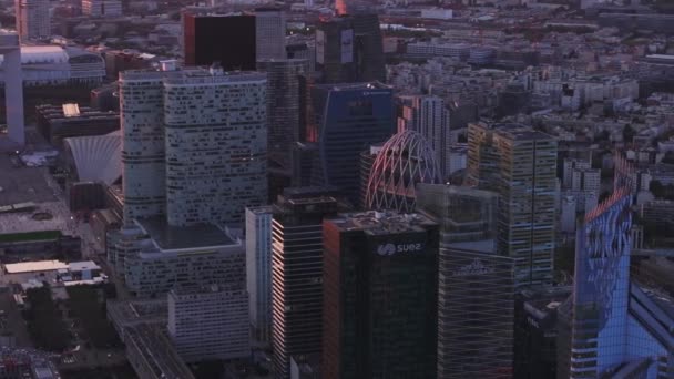 Aerial slide and pan footage of futuristic buildings in modern business district at dusk. Financial center in La Defense. Paris, France. - Footage, Video