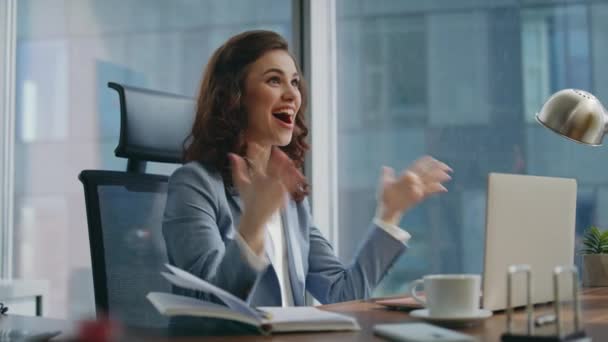 Woman winner looking at laptop feeling happiness in modern office close up. Happy businesswoman celebrating success at workplace. Excited girl professional rejoicing triumph business achievement. - Footage, Video