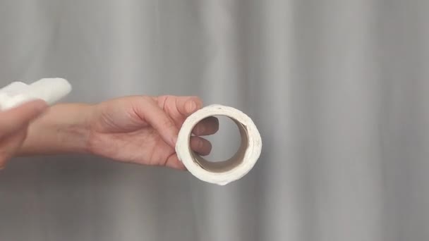 Man uses toilet paper. Roll of toilet paper - Footage, Video