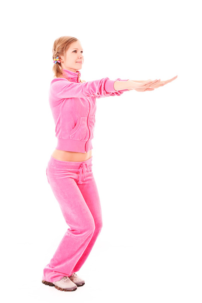 Mujer joven haciendo ejercicio aislado en blanco
 - Foto, imagen