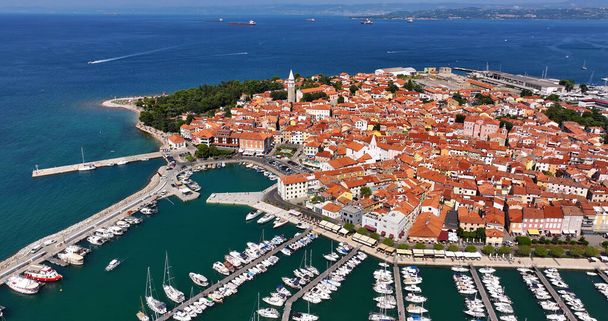 Aerial view embankment of the marina with boats in the Adriatic Sea in Izola fishing town, Slovenia - Photo, Image