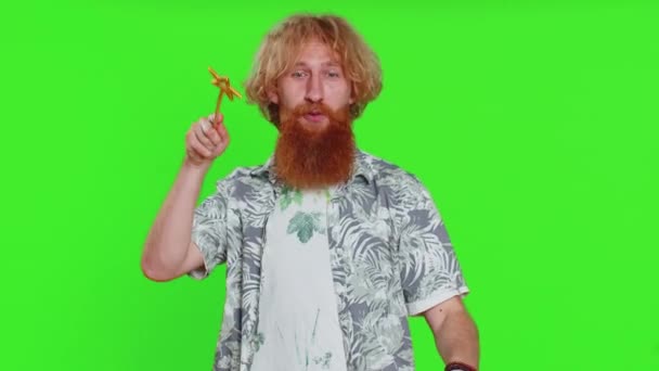 Magician witch young man gesturing with magic wand fairy stick, making wish come true casting magician spell advertising holidays sale discount. Caucasian bearded guy isolated on chroma key background - Footage, Video