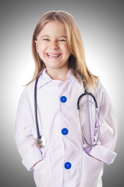 Little girl in doctor costume - 写真・画像