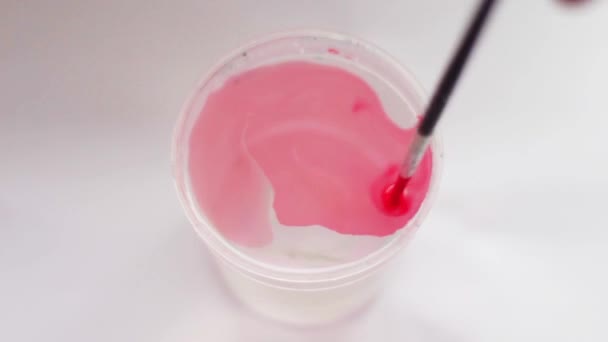 Paint, which is dissolved in a glass of water - Footage, Video