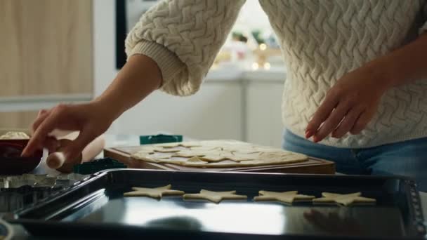 Unrecognizable woman cutting out gingerbread cookies from the dough. Shot with RED helium camera in 8K.    - Footage, Video
