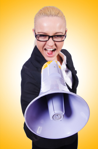Young businesswoman with loudspeaker - Photo, Image