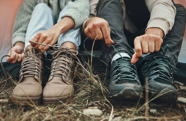 Shoes, people tie shoelace and hiking outdoor in nature park for travel and adventure, explore and zoom. Boots, camping with start or prepare for walk, trekking and journey with health and fitness. - Photo, Image