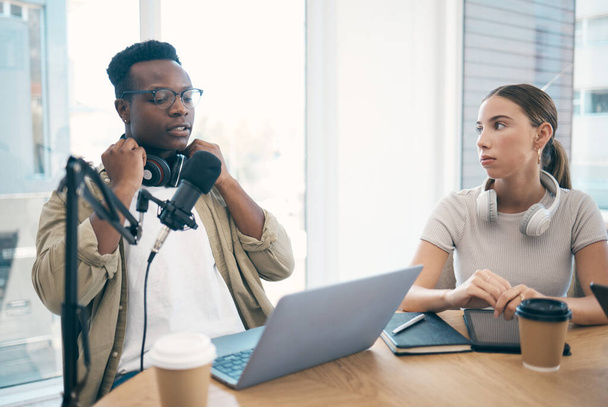 Man, podcast team and streaming live or online recording, creative conversation or microphone. Black male person, woman or laptop office for social network, influencer audience or content creating. - Photo, Image