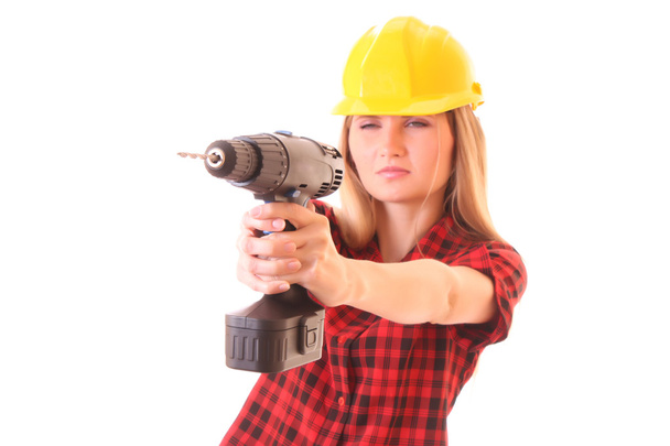 Young girl in helmet with drill isolated on white - Foto, immagini