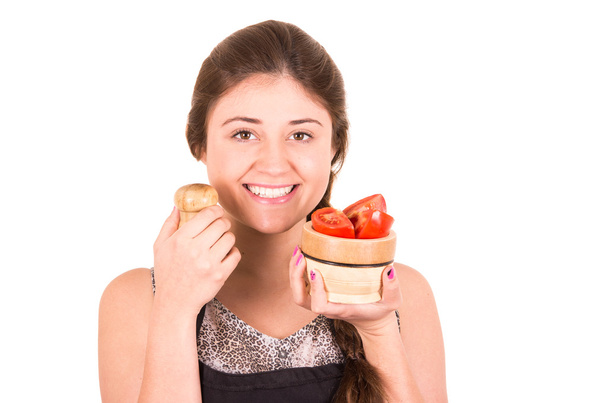 beautiful young girl eating fresh tomatoes - Fotoğraf, Görsel