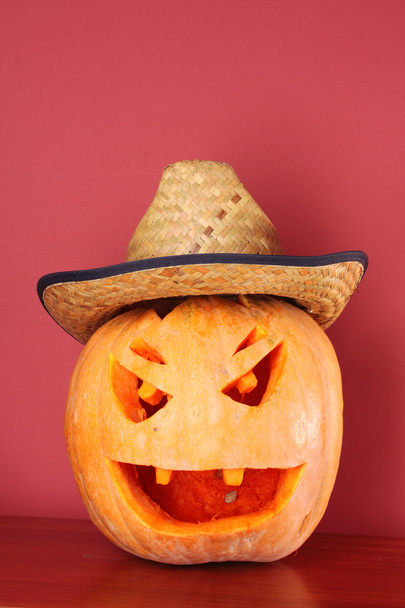 Pumpkin in hat on the table - Φωτογραφία, εικόνα