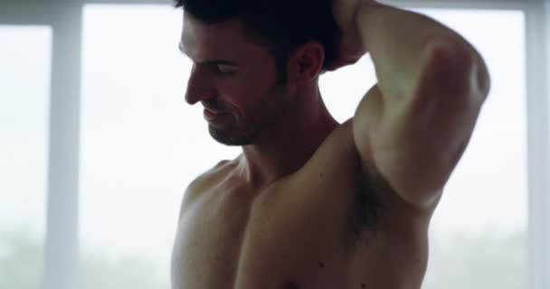 Home, muscular and man with health, thinking and smile with self care, sexy and beautiful guy. Person, house and bodybuilder with fitness, wellness and beauty with confidence, proud and bedroom. - Footage, Video