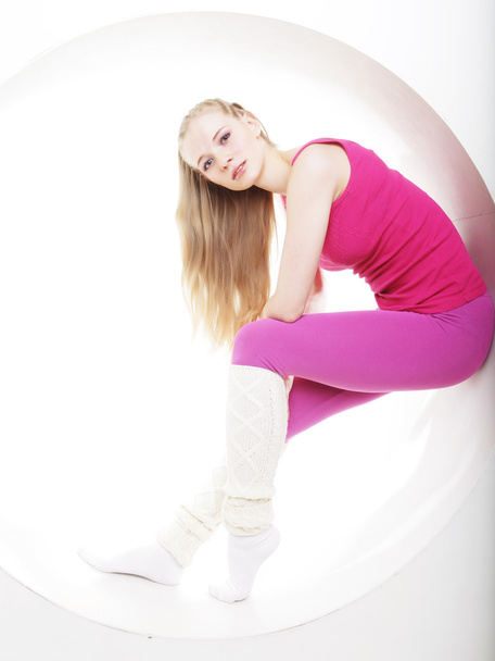 sporty woman posing in pink circle - Foto, Bild