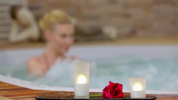 Spa resort jacuzzi hot tub woman. Happy woman relaxing in jacuzzi. Woman in spa salon. - Footage, Video